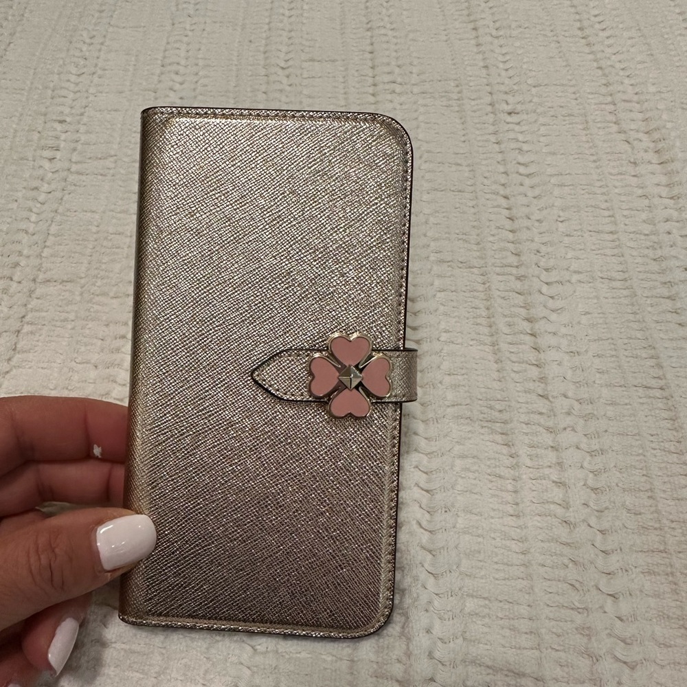 Kate Spade X/XS iPhone case in rose gold.